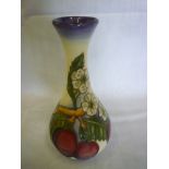 A Moorcroft pottery tapered spill vase with plum decoration 6½" high
