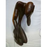 An unusual large wood sculpture of a kneeling figure 27" high