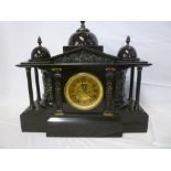 A 19th century mantel clock with gilt circular dial in impressive polished black slate pavilion-