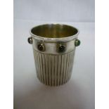 An unusual electroplated cylindrical beaker, the rim decorated with semi-precious cabochons by Parks