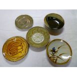 Five large Studio pottery bowls and chargers including large slip ware decorated bowl, frog design
