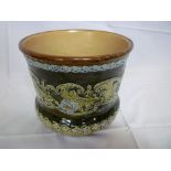 A late 19th century Doulton Lambeth pottery jardiniere with raised floral and leaf decoration on
