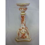 A Royal Crown Derby china "Red Aves" pattern candlestick with bird decoration on square base
