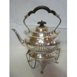 A late Victorian silver oval spirit kettle with  gradooned decoration and ebonised handle on