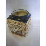 A Troika pottery marmalade-style vase with geometric decoration on brown ground marked "Troika