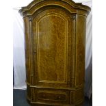 An impressive 19th century Continental armoire wardrobe with highly figured stained graining,