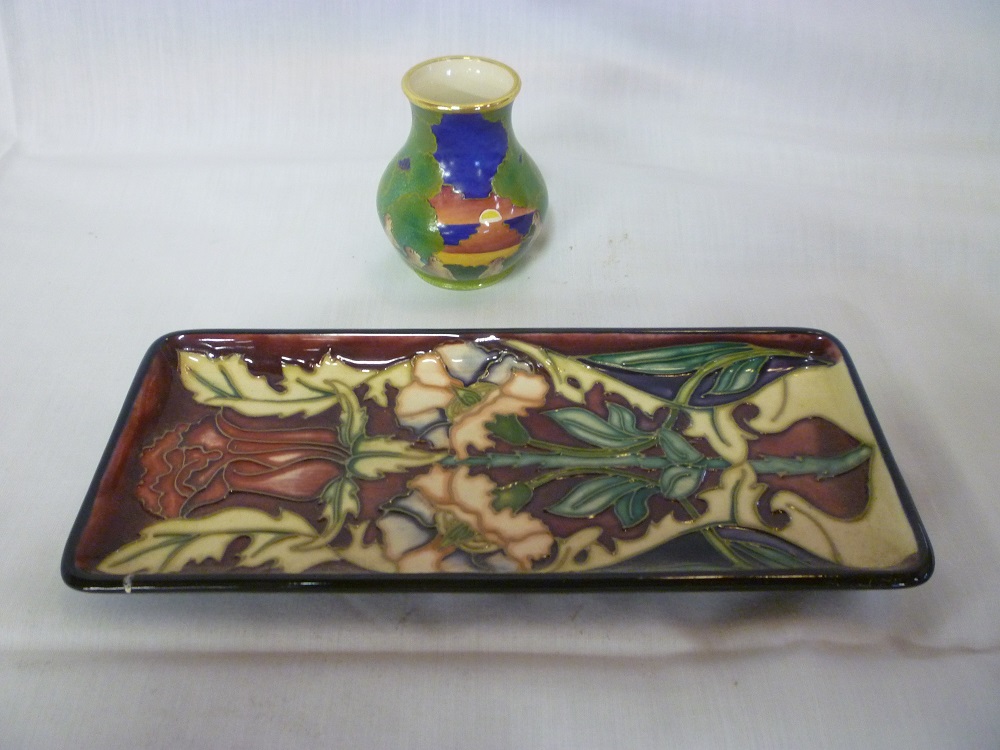 A Moorcroft pottery rectangular pin tray with floral decoration, boxed and a Moorcroft limited