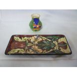 A Moorcroft pottery rectangular pin tray with floral decoration, boxed and a Moorcroft limited