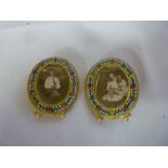 A pair of miniature gilt oval photo frames with inset mosaic leaf decoration