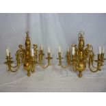 A pair of good quality brass six branch chandelier light fittings with scroll decoration