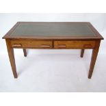 An early 20th Century oak writing table,