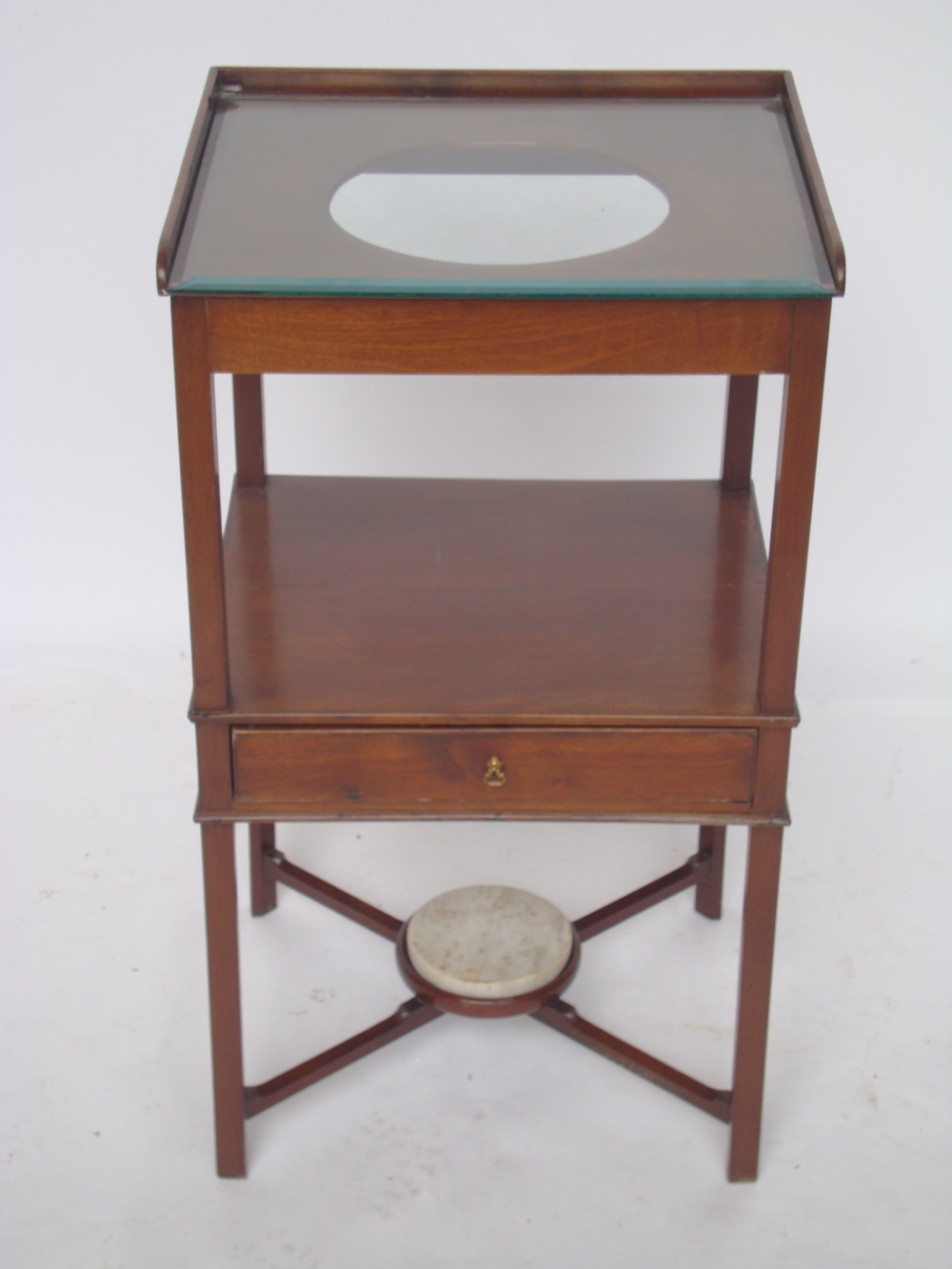 A George III mahogany washstand, the squ