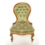 A Victorian mahogany nursing chair, with