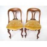 A pair of Victorian mahogany chairs, wit