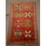 A Caucasian design carpet.  264 x 159cm.