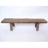 An 18th/19th Century oak pig bench, the