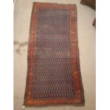 A Kurdish rug.  340 x 163cm.