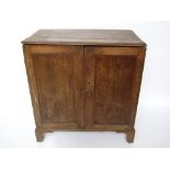 An early George III oak cupboard, the re