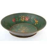 A green tole oval dish painted with flor