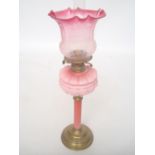 A Victorian brass oil lamp with moulded