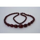 WITHDRAWN A graduated cherry amber bead