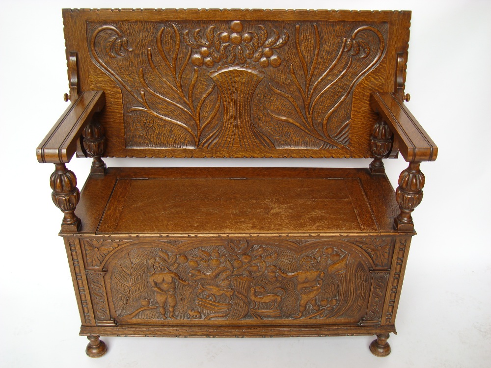 An early 20th Century oak monks bench, t