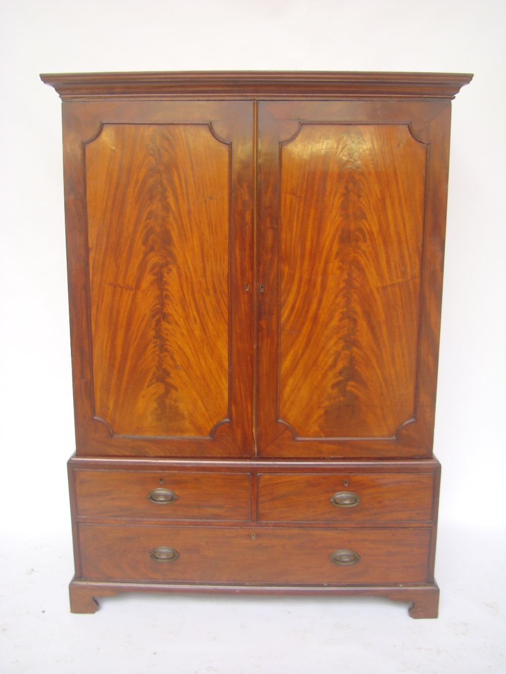 A George III mahogany linen press.  The