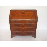 An 18th Century oak bureau, the sloped f