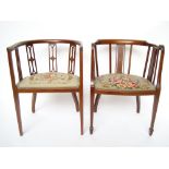Two similar Edwardian mahogany tub armchairs, with strung frames,