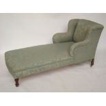 A late Victorian upholstered single end Howard and Sons style day bed with turned legs and brass