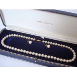 A single string of graduated cultured pearls, with 9ct gold clasp,