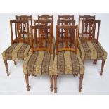 A set of ten Indian teak dining chairs,