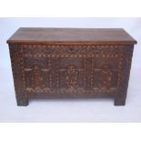 A 17th Century and later oak and marquetry inlaid oak coffer,