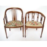 A pair of similar Edwardian mahogany tub chairs, one with strung and marquetry inlaid frame,