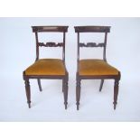 A pair of late Regency beech side chairs,