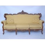 An early 20th Century French Louis XV style beech settee,