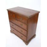 An 18th Century oak and mahogany chest of drawers,
