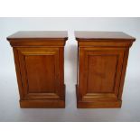 A pair of French Grange furniture cherry wood bedside cabinets,