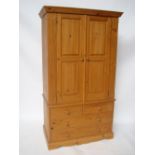 A twentieth century pine double wardrobe.