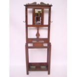 An Edwardian walnut hall stand,