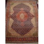 A Persian carpet.
273 x 372cm.