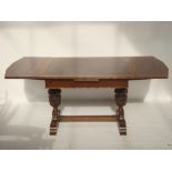 An early 20th Century draw leaf refectory style dining table,