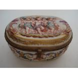 A late 19th Century French porcelain Capodimonte style oval box,