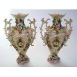 A pair of late 19th Century German Dresden style twin handled vases,