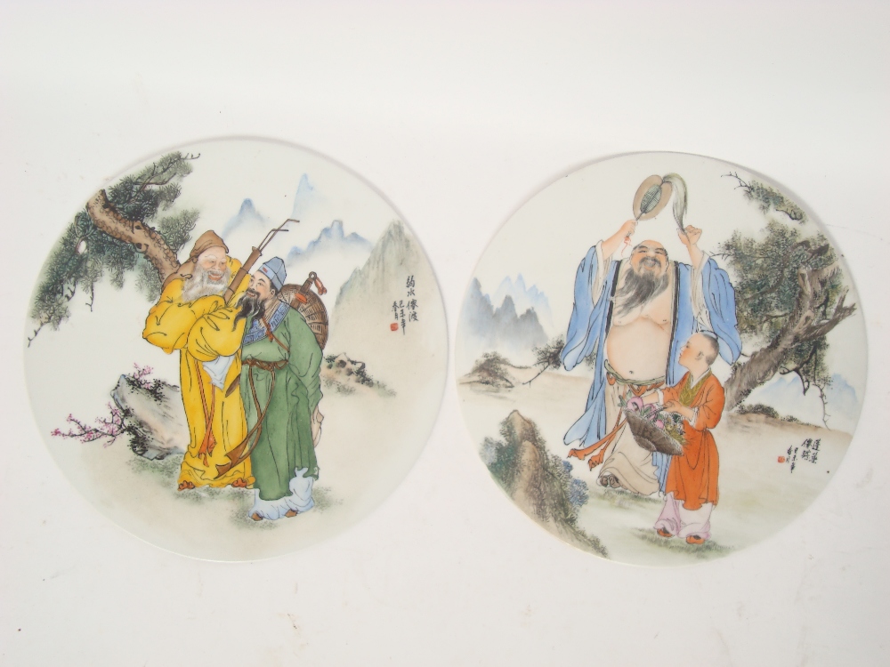 A pair of Chinese circular porcelain plaques,