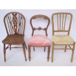 A 19th Century ash and elm wheel back kitchen chair together with a Victorian walnut spoonback