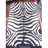 A contemporary zebra print rug.
150 x 240cm.