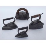 A late 19th Century J & J Siddons elliptical sleeve iron with wooden handle and trivet base,