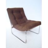 A 1970's tubular steel framed easy chair,