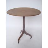 A George III mahogany pedestal table, the oval top strung and inlaid with central oval fan patterae,